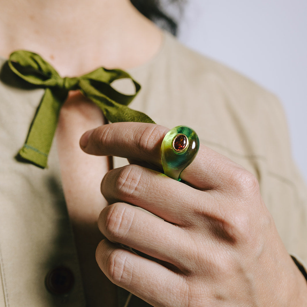 Close-up of model's hand wearing Lizzie Fortunato Monument Ring in Lime