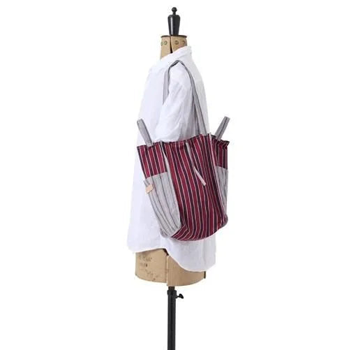 AMIACALVA easy bag rectangular tote with maroon, red and grey stripes shown on shoulder of mannequin