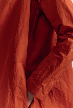 Close-up on orange crinkled fabric from Casey Casey dress
