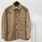 TOOGOOD cotton khaki mechanic jacket on hanger against white backdrop